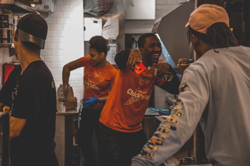 Punch pizza team members working together in a warm restaurant environment