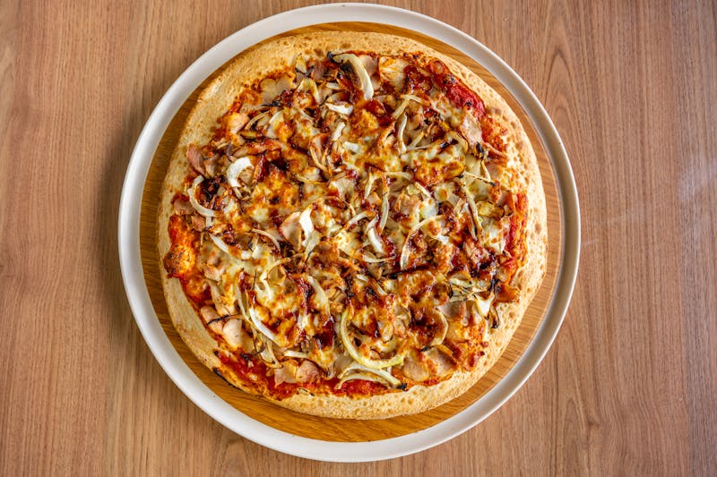 Chicken Ranch pizza with grilled chicken and ranch drizzle
